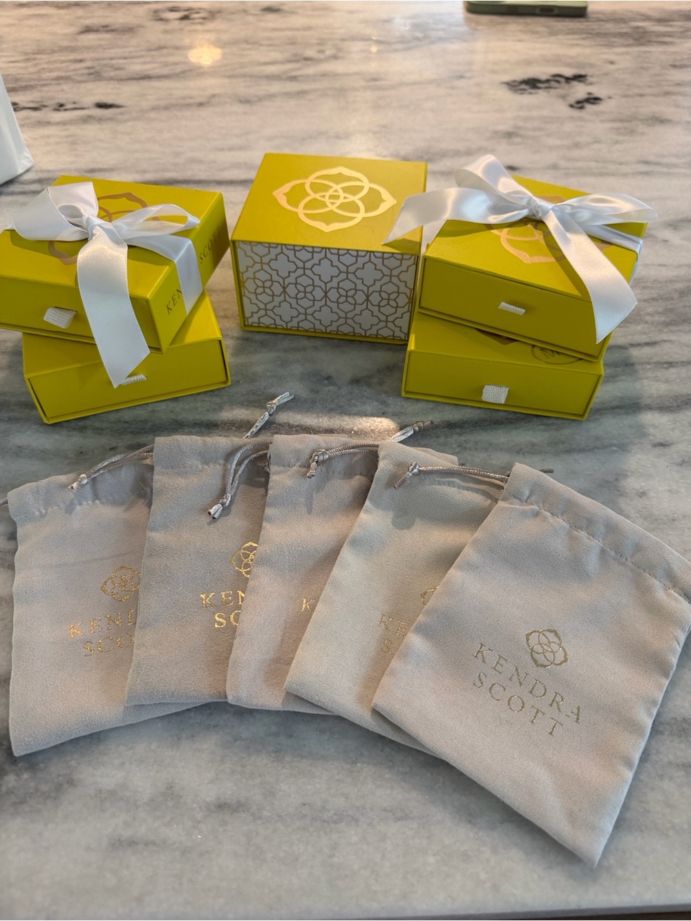 Kendra Scott Yellow Boxes with White Ribbons and dust bags